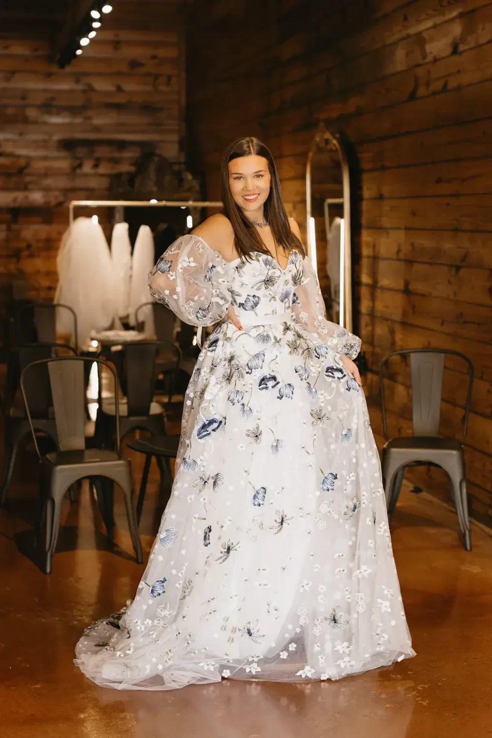 model is wearing a bohemian bridal gown